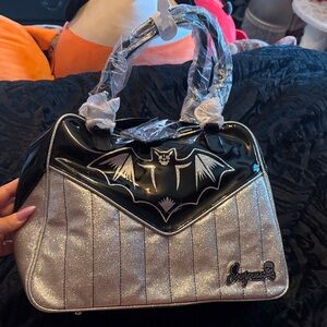 Never used sourpuss silver bowler purse
